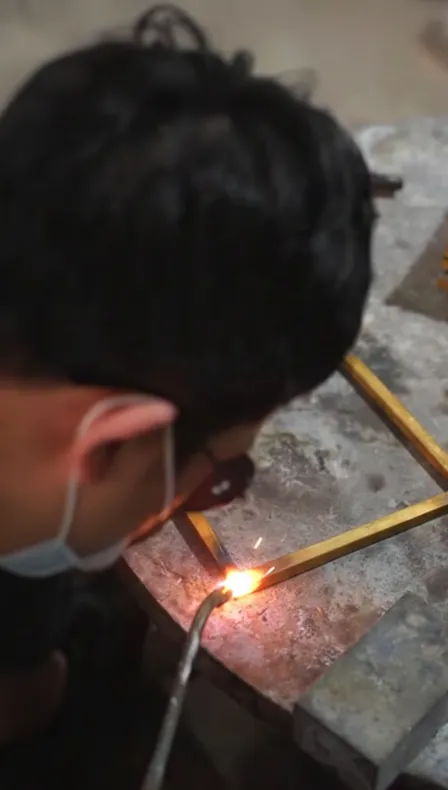 Soldering bespoke brass lantern prototype
