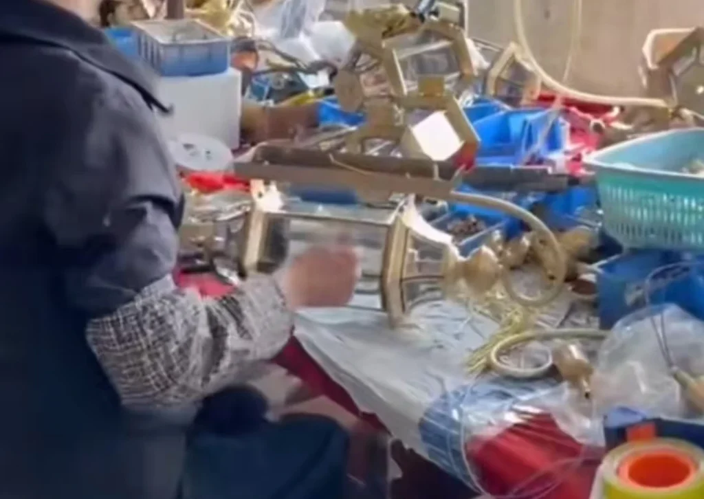 Squared brass lantern frame checked for alignment